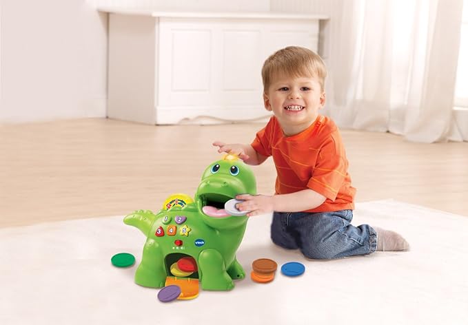 VTech Baby Feed Me Dino | Musical Baby Toy with Numbers, Counting Music & Shapes | Interactive Light Up Toy Suitable from 1, 2, 3 Year Olds Boys & Girls, Green, 27 x 12.3 x 26 cm